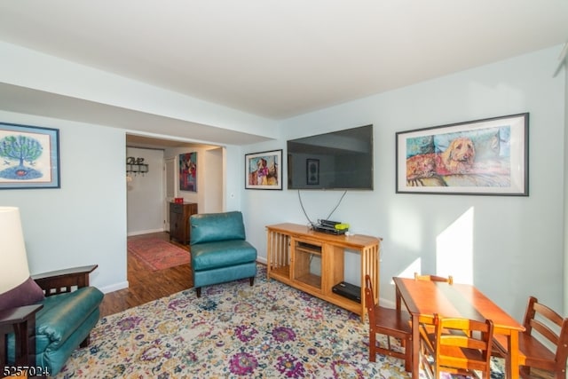 living area with hardwood / wood-style floors