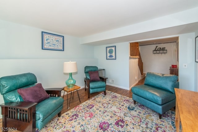 living area with hardwood / wood-style flooring