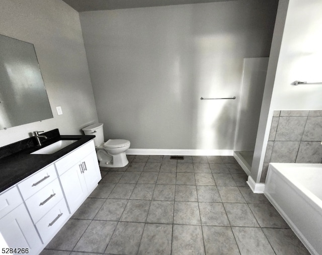 bathroom with a bath, tile patterned floors, vanity, and toilet