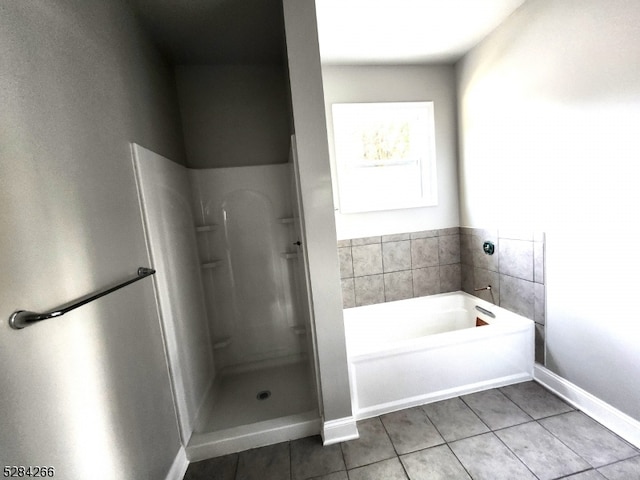 bathroom with plus walk in shower and tile patterned floors