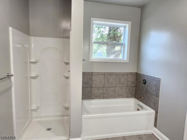 bathroom featuring tile patterned floors and plus walk in shower