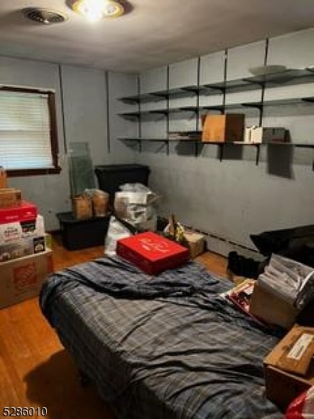 bedroom featuring wood-type flooring