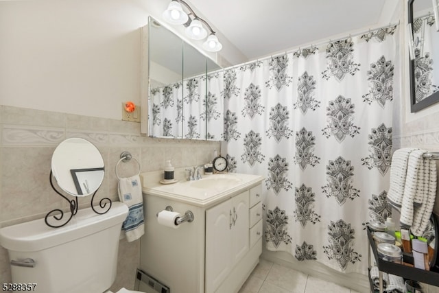 bathroom with tile flooring, tile walls, backsplash, toilet, and large vanity