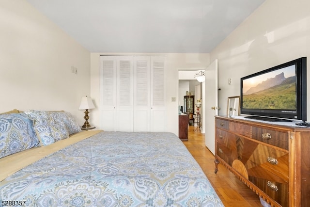 bedroom featuring a closet and light hardwood / wood-style floors