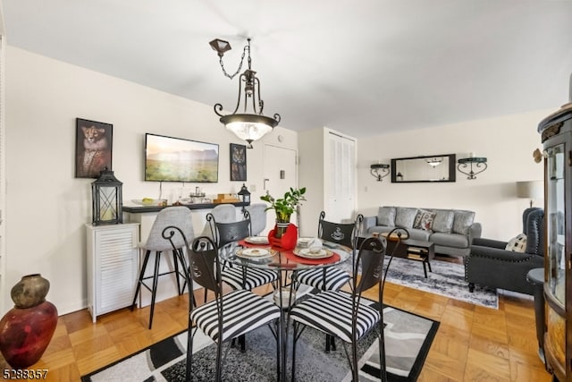 dining room with light parquet floors