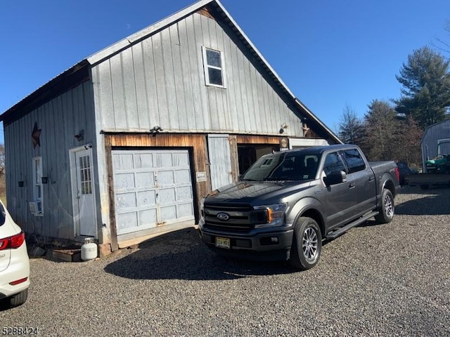 exterior space with an outbuilding and a garage