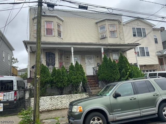 view of property with covered porch