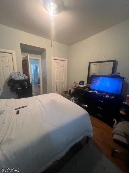 bedroom featuring dark hardwood / wood-style flooring