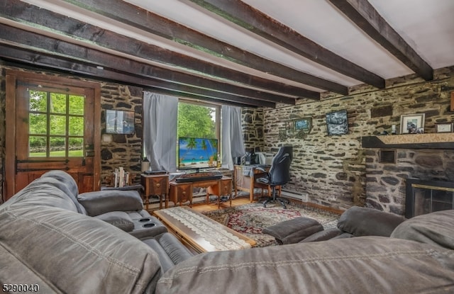 living room with a stone fireplace, hardwood / wood-style floors, and beamed ceiling