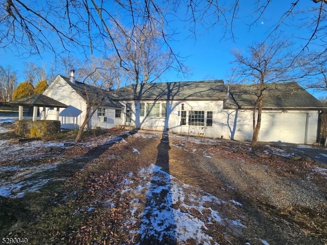 ranch-style home featuring a garage