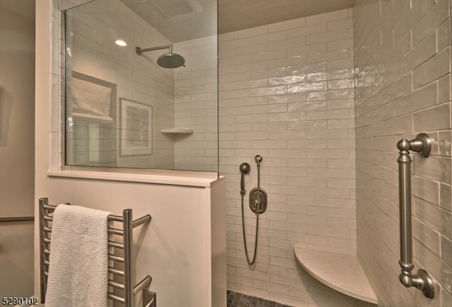 bathroom featuring tiled shower