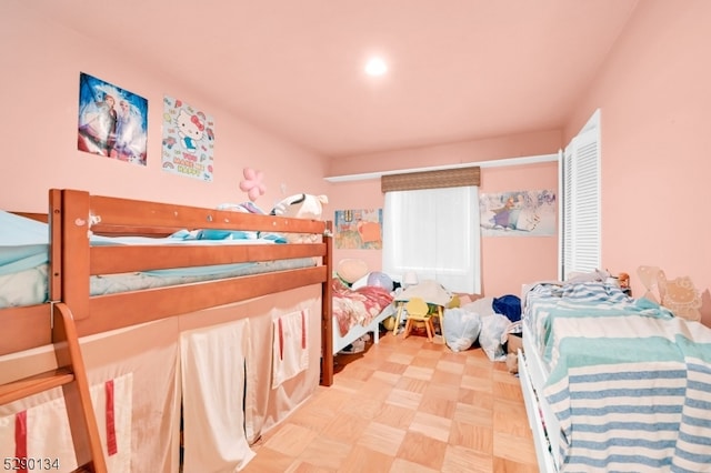 bedroom featuring light parquet flooring