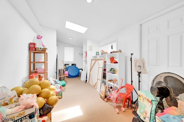 rec room featuring carpet floors and a skylight