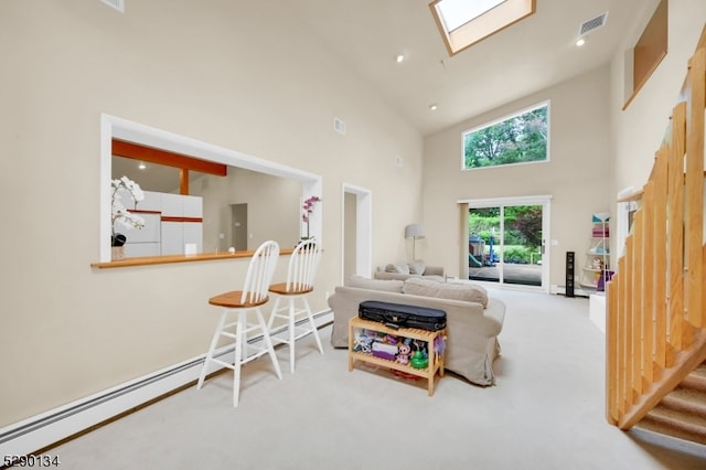 carpeted living room with high vaulted ceiling, a baseboard heating unit, and a skylight