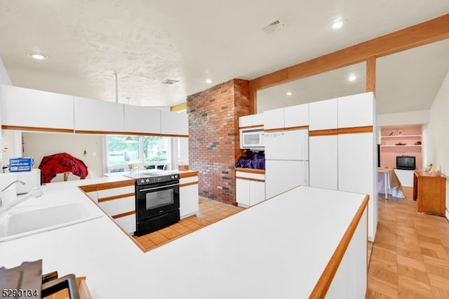 kitchen featuring white appliances, light parquet flooring, brick wall, sink, and white cabinetry