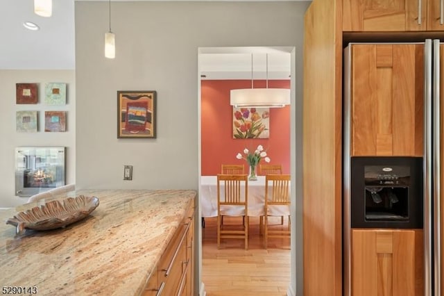 268 Stonehouse Rd, Bernards Twp, NJ 07920 - kitchen with paneled refrigerator, wood finished floors, light stone countertops, recessed lighting, and decorative light fixtures