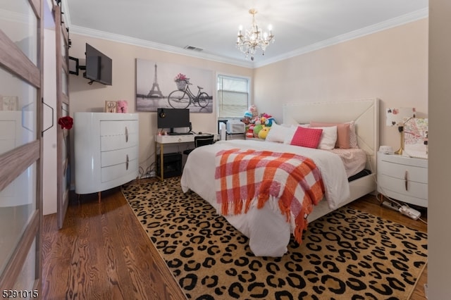 bedroom with an inviting chandelier, ornamental molding, and hardwood / wood-style flooring