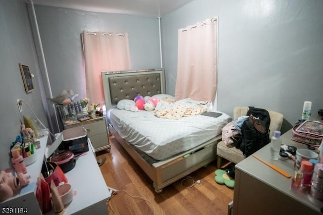 bedroom with light hardwood / wood-style floors