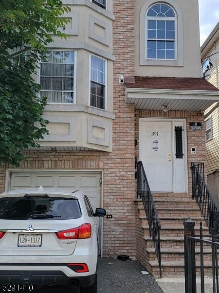 entrance to property featuring a garage