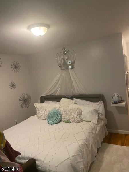 bedroom featuring wood-type flooring