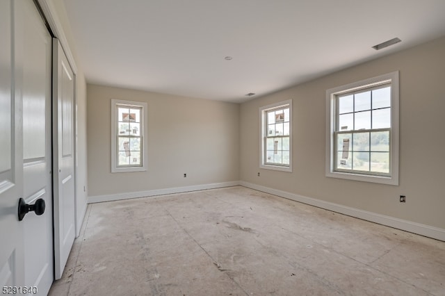 spare room featuring a wealth of natural light