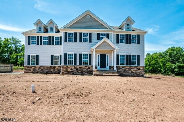 colonial-style house with a front yard