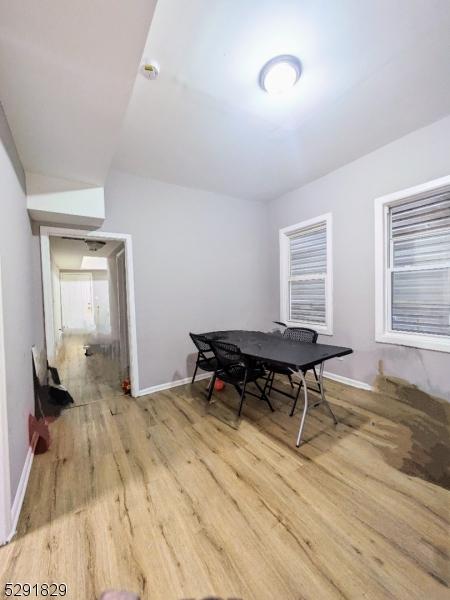 dining space with light hardwood / wood-style flooring