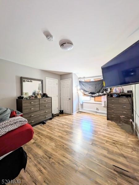 bedroom with light wood-type flooring