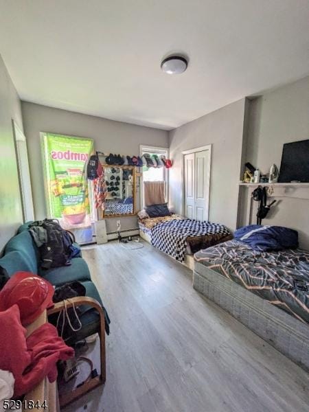 bedroom featuring hardwood / wood-style floors and a closet