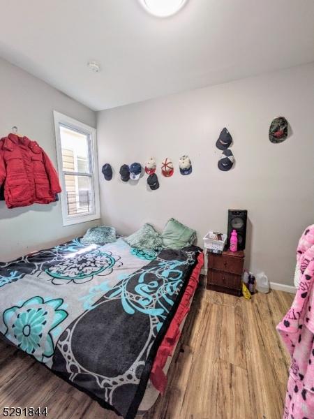 bedroom featuring hardwood / wood-style flooring