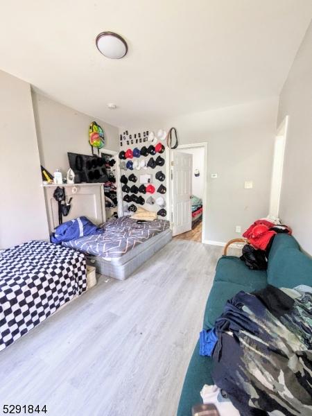 bedroom with hardwood / wood-style floors