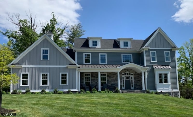 rear view of property with a yard