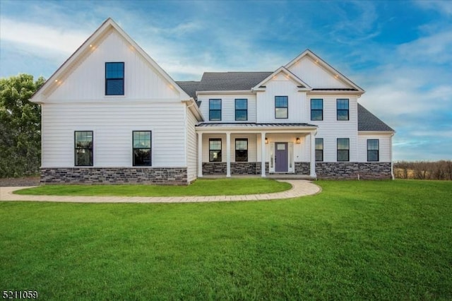 view of front of home with a front lawn and a porch