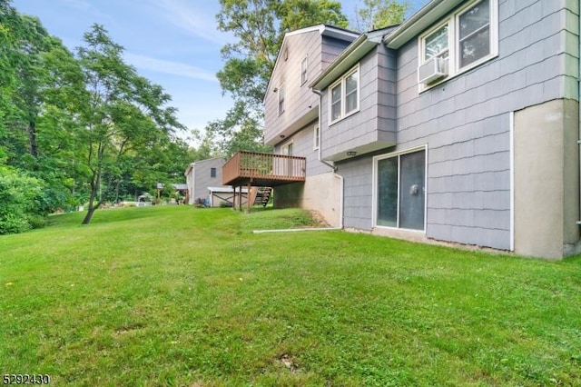 view of yard featuring a wooden deck and cooling unit