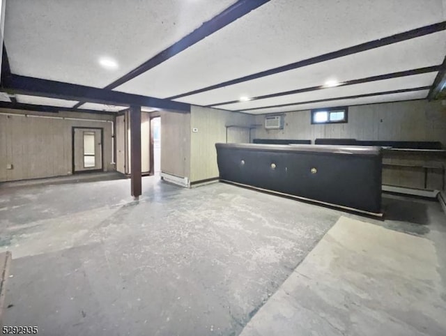 basement featuring a wall mounted air conditioner