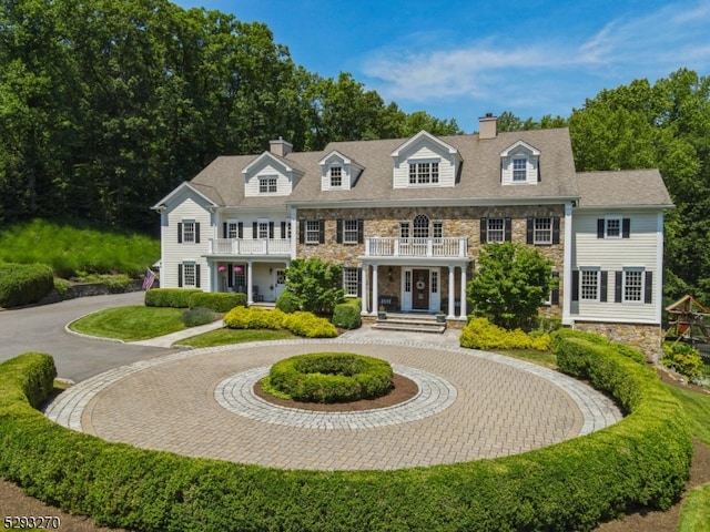 view of front of house with a balcony