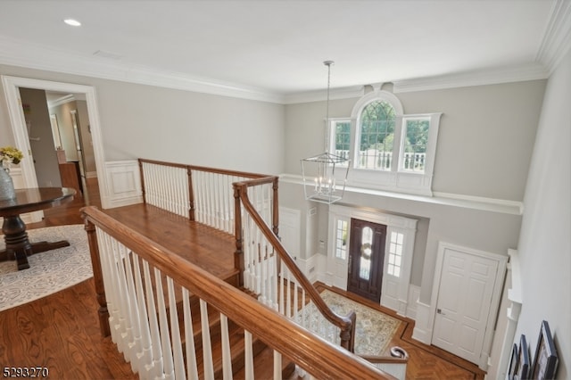 entryway featuring dark wood-type flooring and crown molding