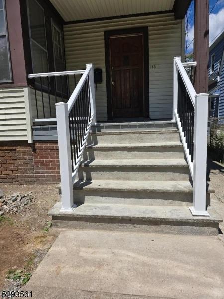 view of exterior entry featuring a porch