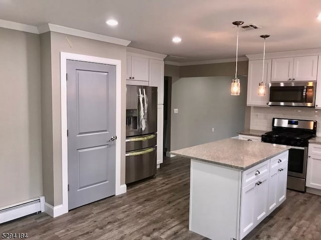 kitchen with white cabinetry, stainless steel appliances, dark hardwood / wood-style floors, pendant lighting, and tasteful backsplash