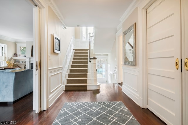 interior space with dark hardwood / wood-style floors and ornamental molding