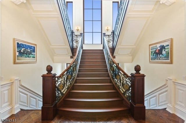 stairway featuring dark parquet floors