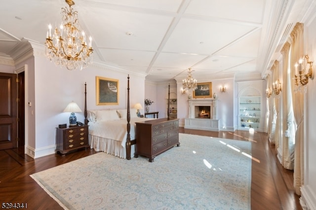 bedroom with coffered ceiling and an inviting chandelier