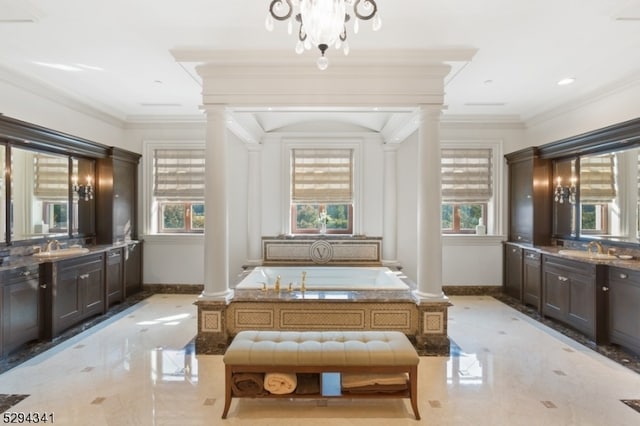 interior space with ornate columns, sink, light tile floors, and crown molding