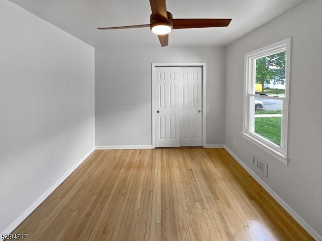 unfurnished room with ceiling fan and light hardwood / wood-style floors