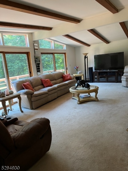 living room with carpet flooring and lofted ceiling with beams