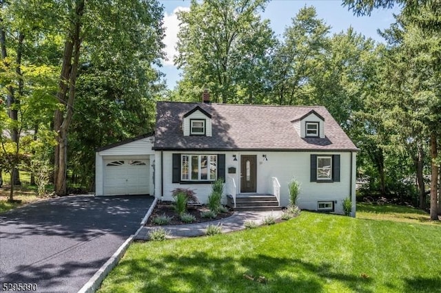 cape cod-style house with a front lawn and a garage