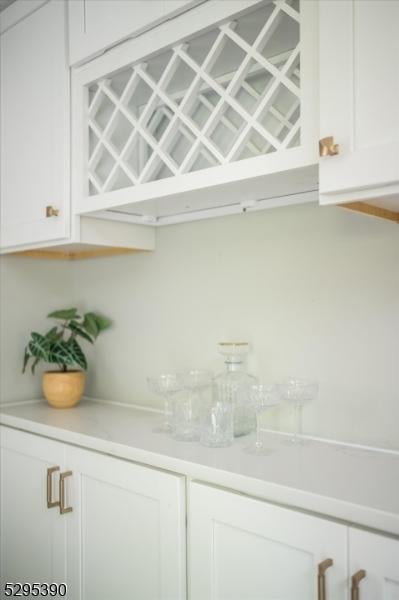 bar with white cabinetry