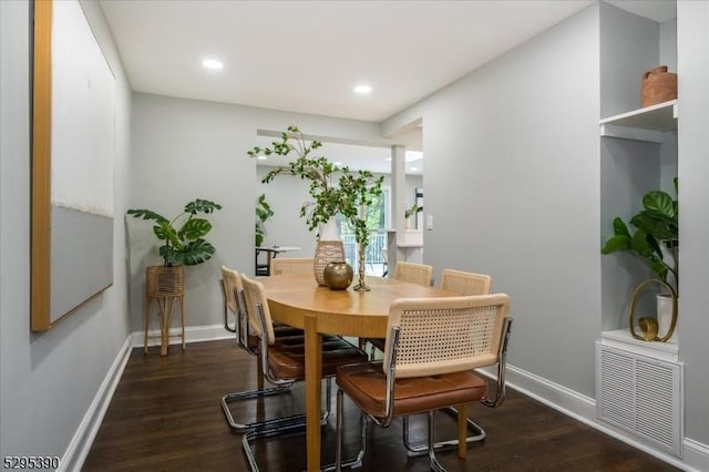 dining area featuring dark hardwood / wood-style floors