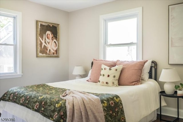 bedroom featuring multiple windows