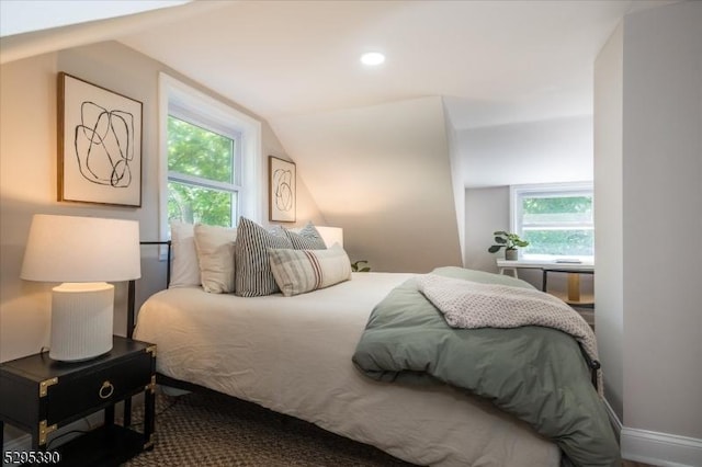 bedroom with lofted ceiling